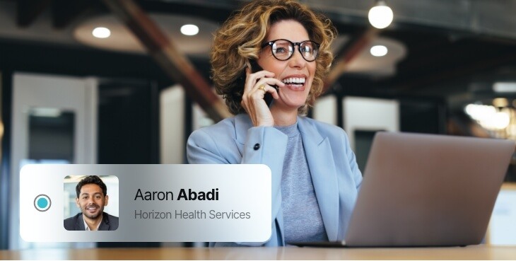 Blonde woman, smiling, chatting on the phone