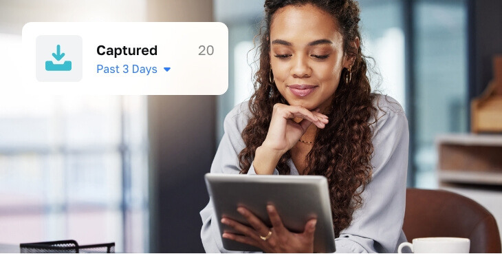 woman looking at her work tablet